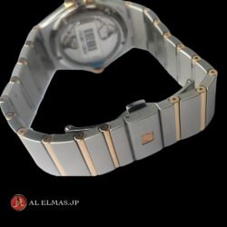 Omega Constellation Co-Axial Chronometer watch with black textured dial, rose gold bezel, date display, and stainless steel and rose gold integrated bracelet.